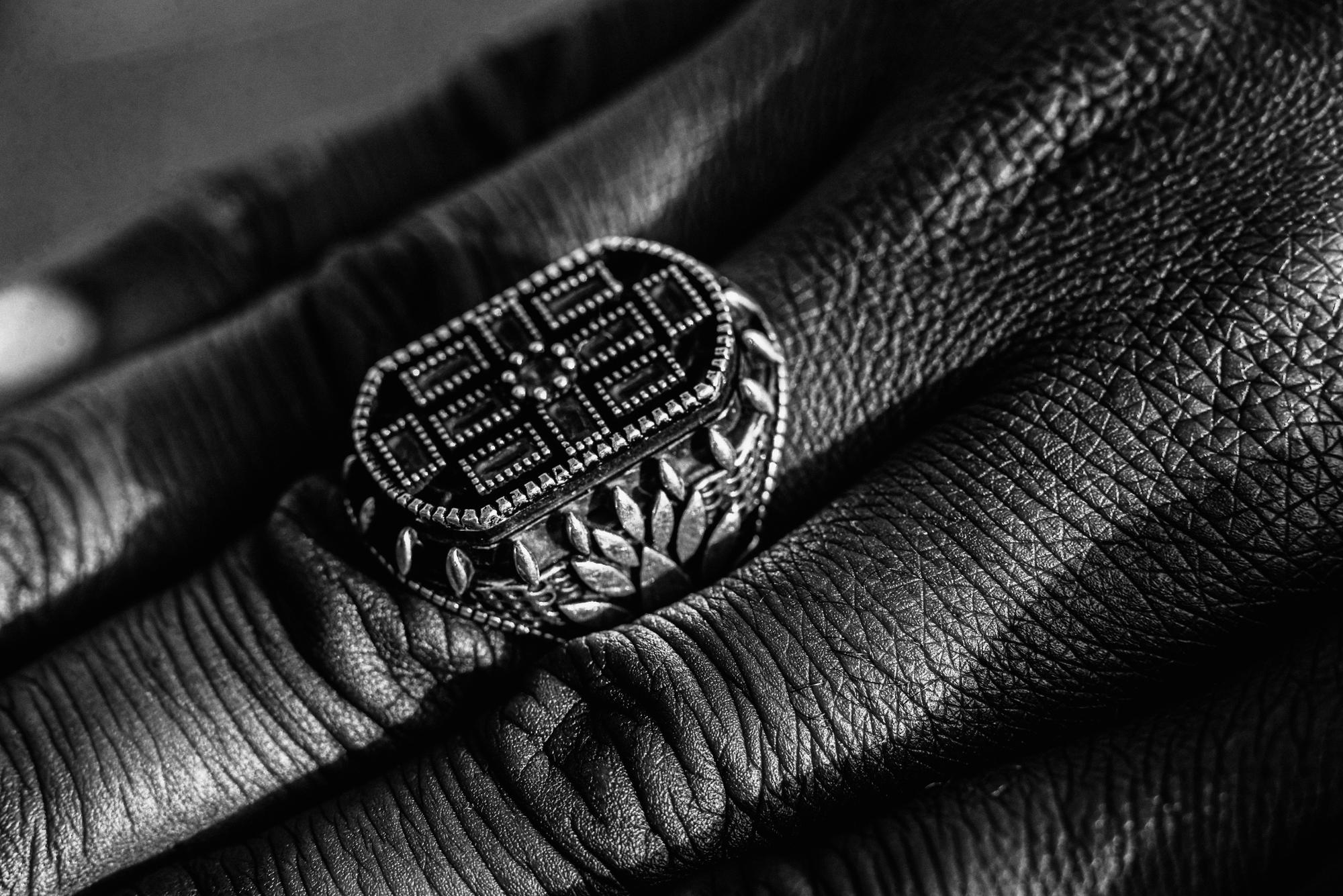 Stitched emblem on tailored jacket